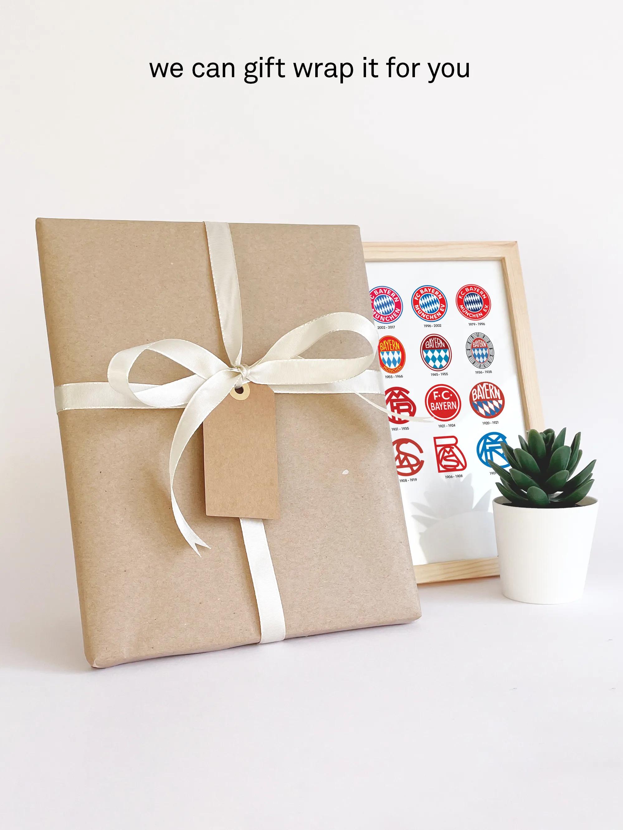 Bayern Munich logo history print gift-wrapped in brown paper with white ribbon and personal note card